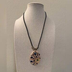 Artisan made painted ceramic floral pendant